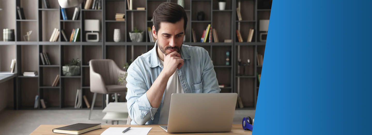 Man sitting at a laptop